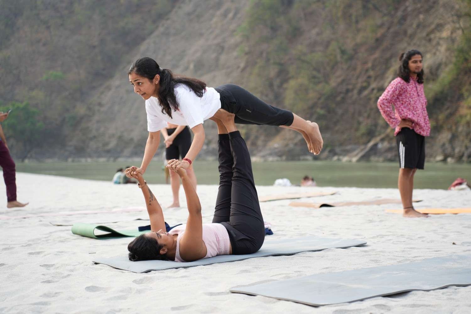 Students learning yoga techniques in Rishikesh India