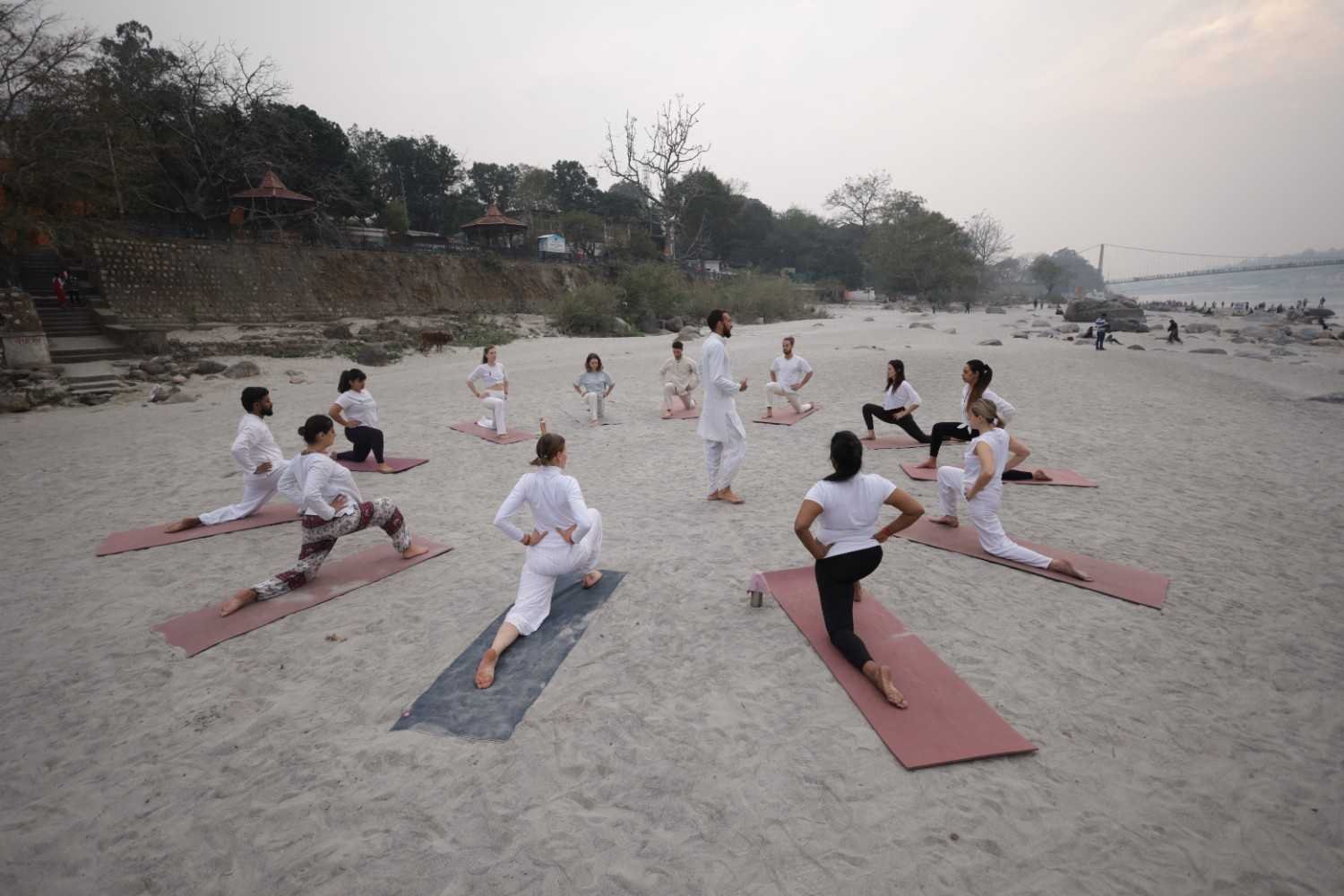 Yoga class and student practice in Rishikesh India